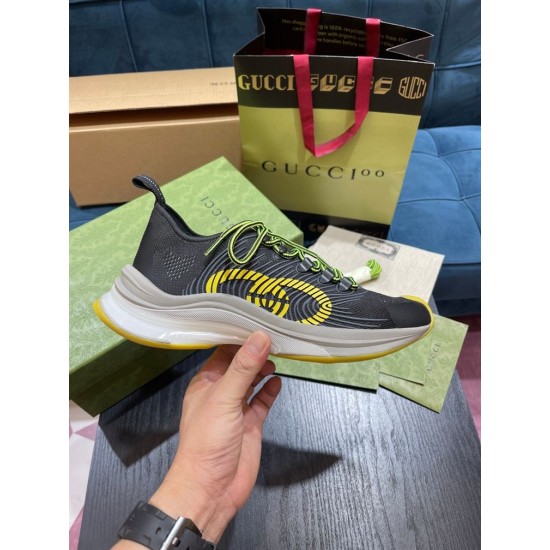Gucci Run Trainer Lateral View in black and yellow Hand holding lateral profile of Gucci Run black mesh trainer highlighting yellow monogram detail