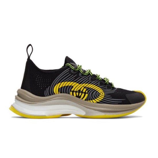 Gucci Run Tech Mesh Trainer Side View in black and yellow Side profile view of Gucci Run black and yellow tech mesh trainer featuring interlocking G print and sculpted sole