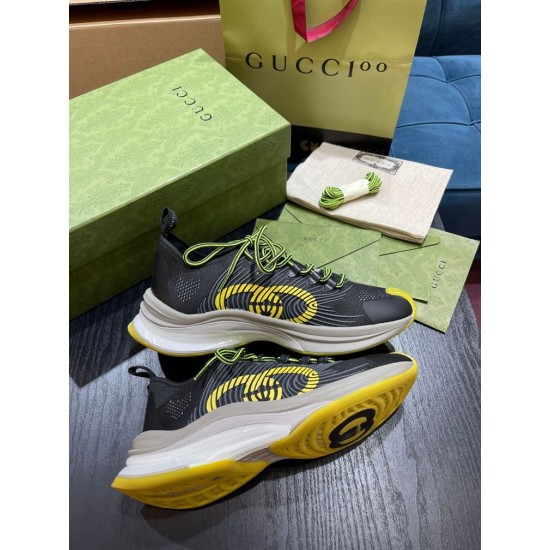 Gucci Run Trainers with Packaging Overview in black and yellow Pair of Gucci Run black and yellow trainers displayed with green shoe box and dust bag showing upper and sole