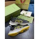 Gucci Run Trainers with Packaging Overview in black and yellow Pair of Gucci Run black and yellow trainers displayed with green shoe box and dust bag showing upper and sole