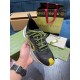 Gucci Run Trainer Upper Detail in black and yellow Close-up hand view of the top and lace unit of Gucci Run trainer in black with yellow accents