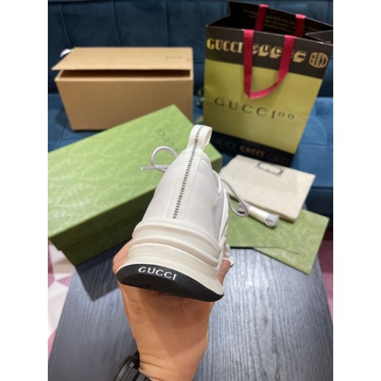Heel View of White Gucci Run Knit Trainer Rear view of white Gucci Run trainer highlighting pull tab and heel sole branding