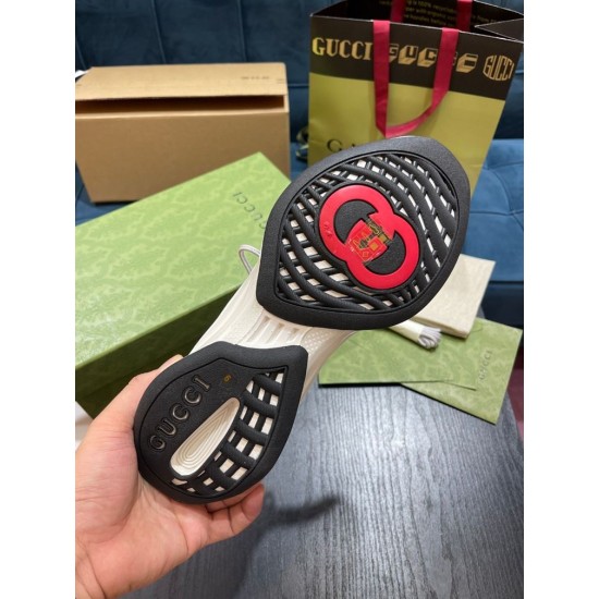 Outsole View of White Gucci Run Knit Trainer Underneath view of black and red rubber outsole pattern on white Gucci Run trainer