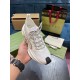Front Lacing View of White Gucci Run Knit Trainer Hand holding single white Gucci Run trainer presenting front lacing detail and toe wrap