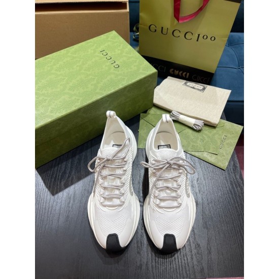 Top View of White Gucci Run Knit Trainers Top-down view of pair of white Gucci Run knit trainers showing lacing and toe caps