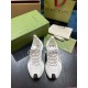 Top View of White Gucci Run Knit Trainers Top-down view of pair of white Gucci Run knit trainers showing lacing and toe caps
