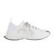Studio Side Profile of White Gucci Run Knit Trainer Studio profile shot of white Gucci Run low top knit trainer on plain background