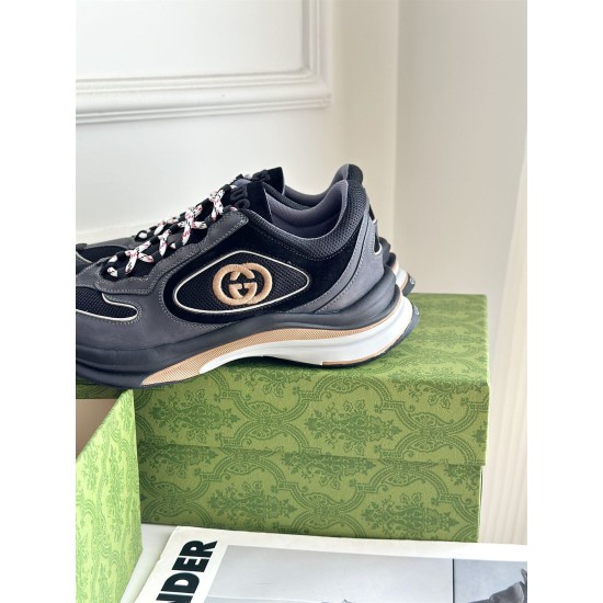 Side heel profile of Gucci grey and black trainer featuring layered sole construction