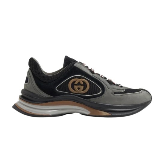 Side profile view of Gucci grey and black run chunky trainer showing logo panel