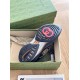 Underside view of grey and black Gucci trainer showing tread sole design