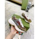 Gucci Rhyton Multicolour Trainer Side Detail in multicolour and white Hand holding Gucci Rhyton GG Multicolour Trainer showing side profile and thick sole in multicolour and white
