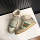 Pair of off-white Gucci Screener high top trainers angled on a white surface in off-white and beige