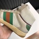 Detailed view of web stripe and textured gum sole on off-white Gucci Screener high top trainers in off-white and beige