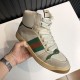 Hand holding off-white beige Gucci Screener high top trainer showing lateral profile