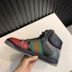 Gucci Screener High Top Trainer Side Detail in black and grey Side profile view of Gucci Screener GG High Top Leather Trainer in grey and red in black and grey