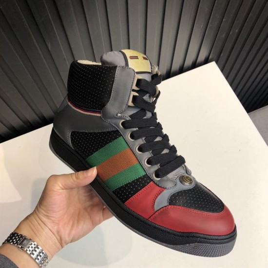 Gucci Screener GG High Top Trainer Front Angle View in grey and black Angled view of Gucci Screener GG high top trainer in grey and black displaying the lace-up front and red toe cap.