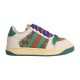 Gucci Screener GG Monogram Beige And Green Trainer Profile View Lateral side view of beige and green Gucci Screener GG monogram low-top trainer