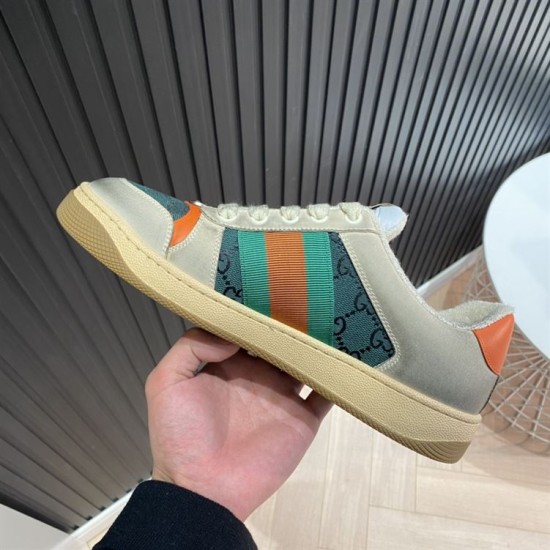 Gucci Screener Trainers Medial Side in beige and green Medial side view of beige Gucci Screener trainer with striped web ribbon in beige and green