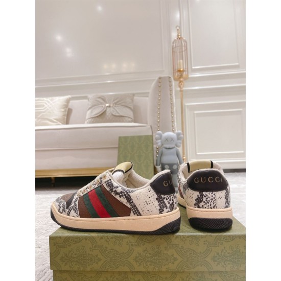 Gucci Screener Python Embossed Leather Trainers Rear View in cream and green Rear view of Gucci Screener python embossed trainers showing black leather heel tab with metallic branding in cream and green