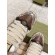 Gucci Screener Python Embossed Leather Trainers Toe Detail in cream and green Close-up of the toe box on Gucci Screener python embossed trainers highlighting the metal double G plaque in cream and green