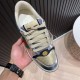 Gucci Screener Metallic Silver Gold Web Stripe Leather Trainers Tongue Detail Close-up of tongue label and oval GG hardware on Gucci Screener Trainers in silver and gold