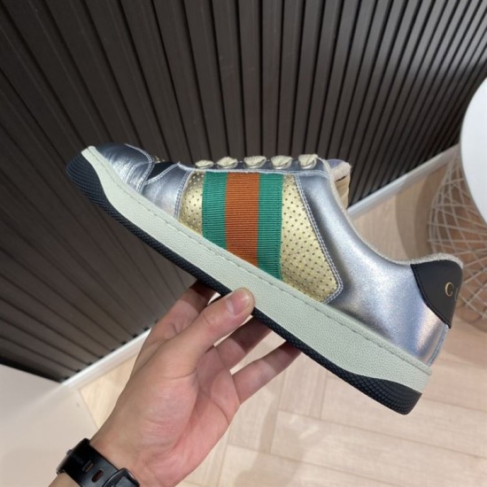 Gucci Screener Metallic Silver Gold Web Stripe Leather Trainers Medial View Medial side view of Gucci Screener Metallic Silver Gold Web Stripe Leather Trainers