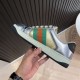 Gucci Screener Metallic Silver Gold Web Stripe Leather Trainers Medial View Medial side view of Gucci Screener Metallic Silver Gold Web Stripe Leather Trainers