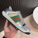 Gucci Screener Metallic Silver Gold Web Stripe Leather Trainers Lateral Side Hand holding Gucci Screener Metallic Silver Gold Web Stripe Leather Trainers lateral side