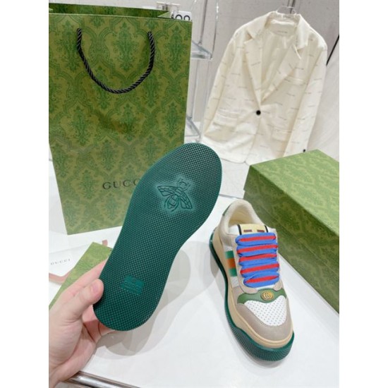 Gucci Screener Trainer Outsole Tread in beige and green Bottom outsole view of Gucci Screener trainer displaying green textured tread and bee emblem in beige and green