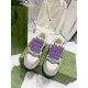 Gucci Screener Trainers Top-Down View in beige and green Top-down view of Gucci Screener trainers showcasing blue striped laces and perforated toe cap in beige and green