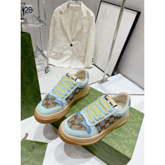 Angled front perspective of both light blue Gucci Screener platform trainers in light blue and beige