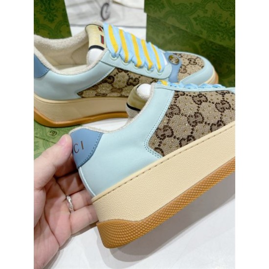 Close-up view of light blue leather upper and thick platform midsole in light blue and beige