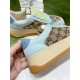 Close-up view of light blue leather upper and thick platform midsole in light blue and beige