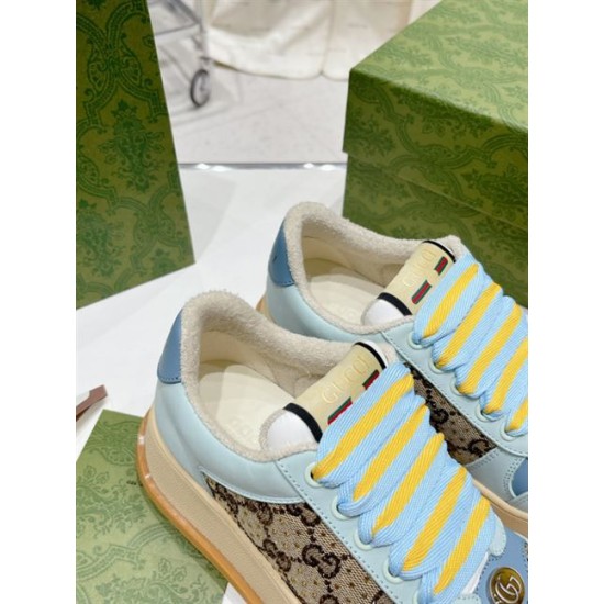 Close-up of the tongue tag and padded collar on light blue Gucci Screener trainers in light blue and beige