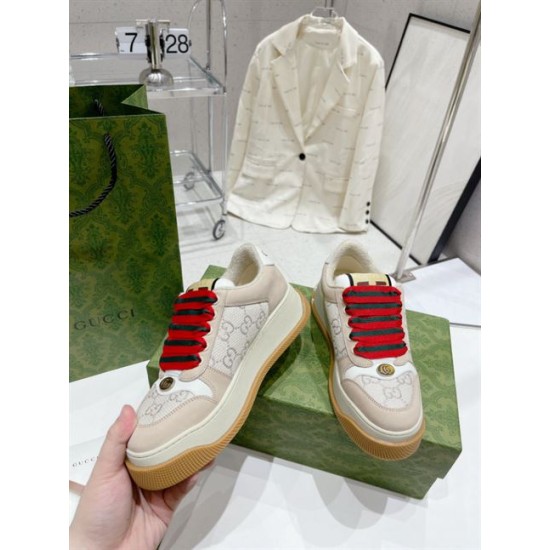 Gucci Screener GG Lurex Beige Platform Trainers Front View Front elevated view of Gucci Screener GG lurex beige platform trainers displaying red and green laces
