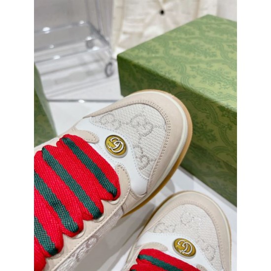 Beige Gucci Screener Trainer Toe Cap and Oval GG Badge Detail Detailed close-up of toe cap and metallic GG badge on beige Gucci Screener trainer