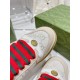 Beige Gucci Screener Trainer Toe Cap and Oval GG Badge Detail Detailed close-up of toe cap and metallic GG badge on beige Gucci Screener trainer
