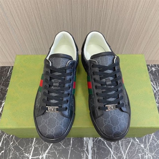 Gucci Black Monogram Web Trainers - Front Pair in black and white Frontal view of both Gucci black monogram web trainers placed on a green shoe box in black and white