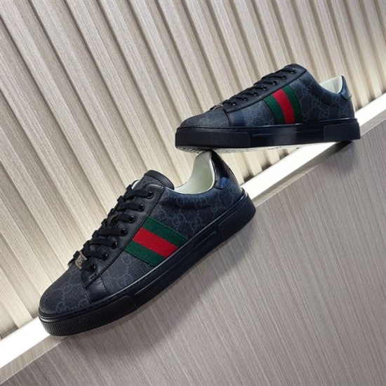 Gucci Black Monogram Web Trainers - Staggered View in black and white Pair of Gucci black monogram leather web trainers arranged on a diagonal surface in black and white