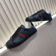 Gucci Black Monogram Web Trainers - Staggered View in black and white Pair of Gucci black monogram leather web trainers arranged on a diagonal surface in black and white