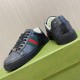 Gucci Black Monogram Web Trainers - Angle View in black and white Gucci black monogram leather web trainers resting on a green box showing the heel and side detailing in black and white