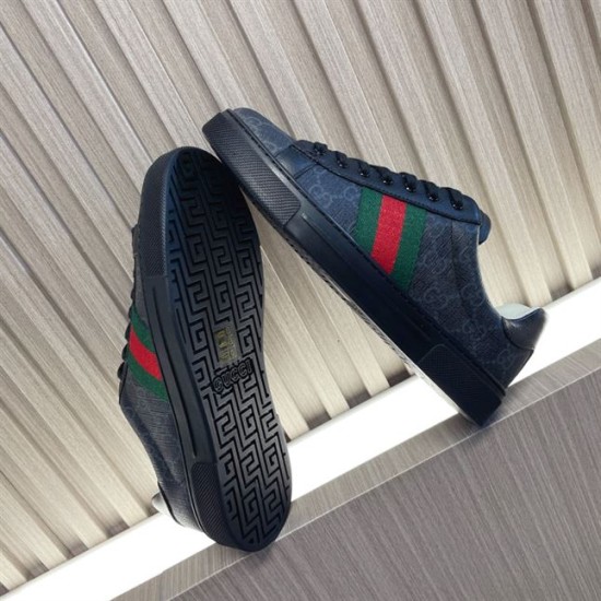 Gucci Black Monogram Web Trainers - Sole View in black and white Gucci black monogram trainer showing the underside black rubber tread and brand lettering in black and white