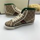 Lateral side view displaying the green and red Web stripe on beige GG canvas high top trainers