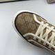 Macro detail view of the toe cap pattern and lace eyelets on beige GG canvas high top trainers in beige and green
