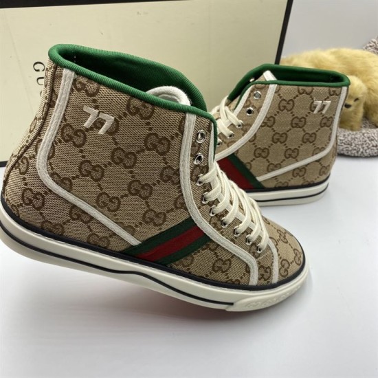Close-up side view showing embroidered 77 logo and off-white piping on beige monogram trainers in beige and green