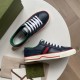 Gucci Tennis 1977 Low Top Blue Leather Trainers laid out on a table with dust bag