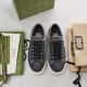 Top-down view of dark grey Gucci Tennis 1977 trainers with packaging