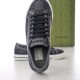 Front view looking down at the tongue label and interior of grey Gucci trainer