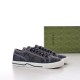 Pair of grey monogram Gucci Tennis 1977 low top trainers angled view