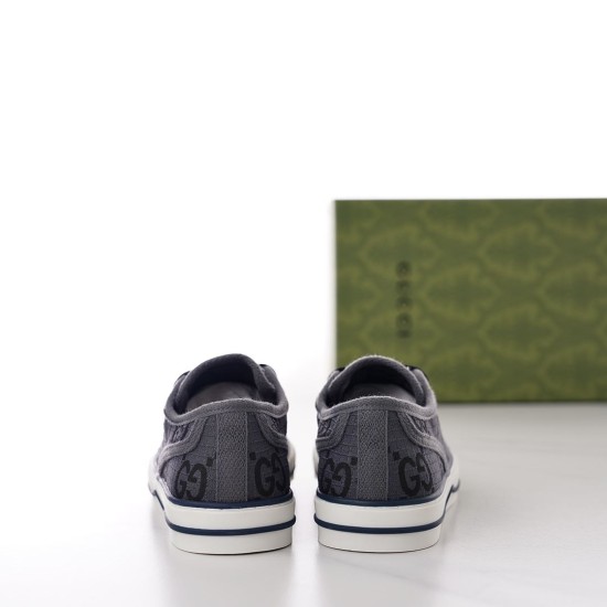 Rear heel view of grey monogram Gucci Tennis 1977 trainers